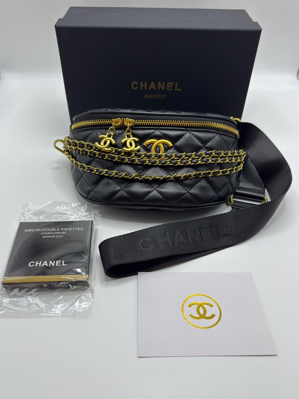 CHANEL Black Quilted Leather Belt Bag with Gold Chain and CC Charms